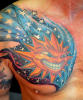 sun_stars_chest_tattoo.jpg